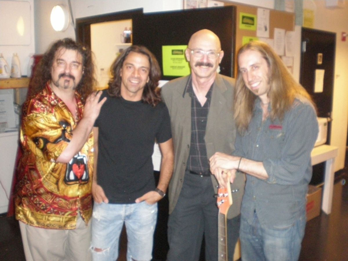 Doug Katsaros (keyboards/conductor), Chris Cicchino (guitar), Tony Levin, Dan Grennes (bass guitar) at 